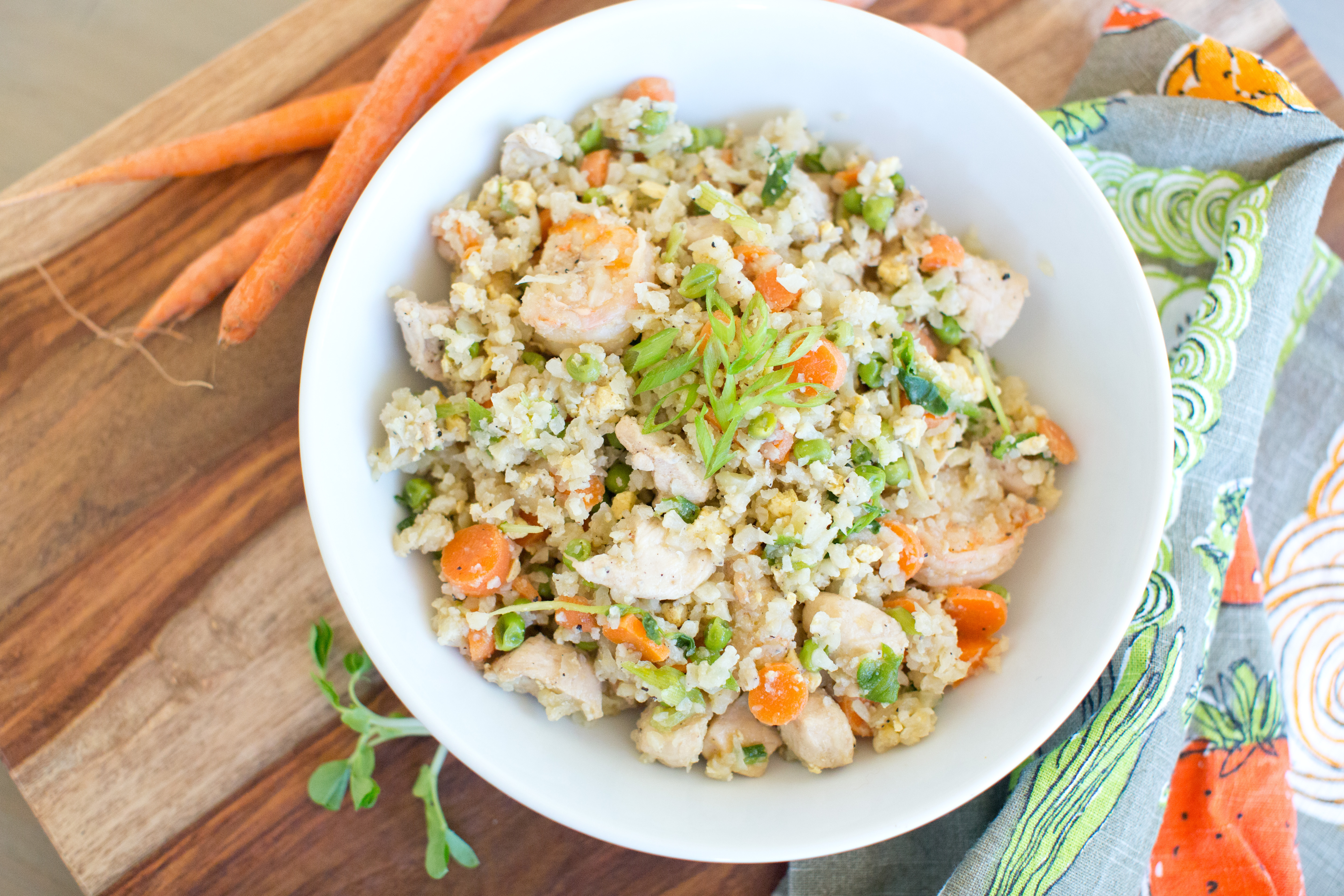 Your favorite chicken and shrimp fried rice with all clean ingredients. Paleo approved! Click through for full recipe on https://bewellbymadison.com!